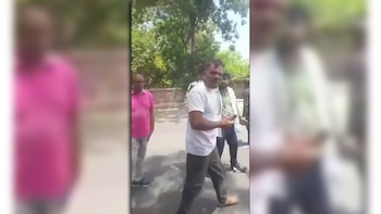 A viral video shows a shaky passenger surrounded by rescuers