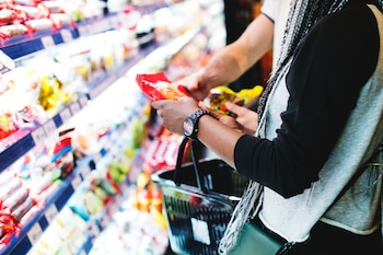 Two people shopping in a supermarket