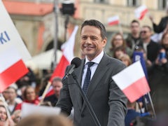 Polling station in Poland with voters casting their votes