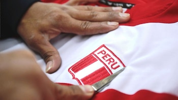 Textile entrepreneurs supervise products with national emblems