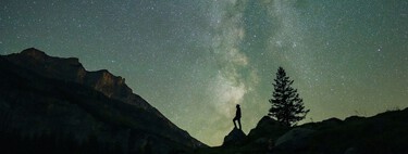 Human gazing at the stars during the Perseids with the Milky Way in the background