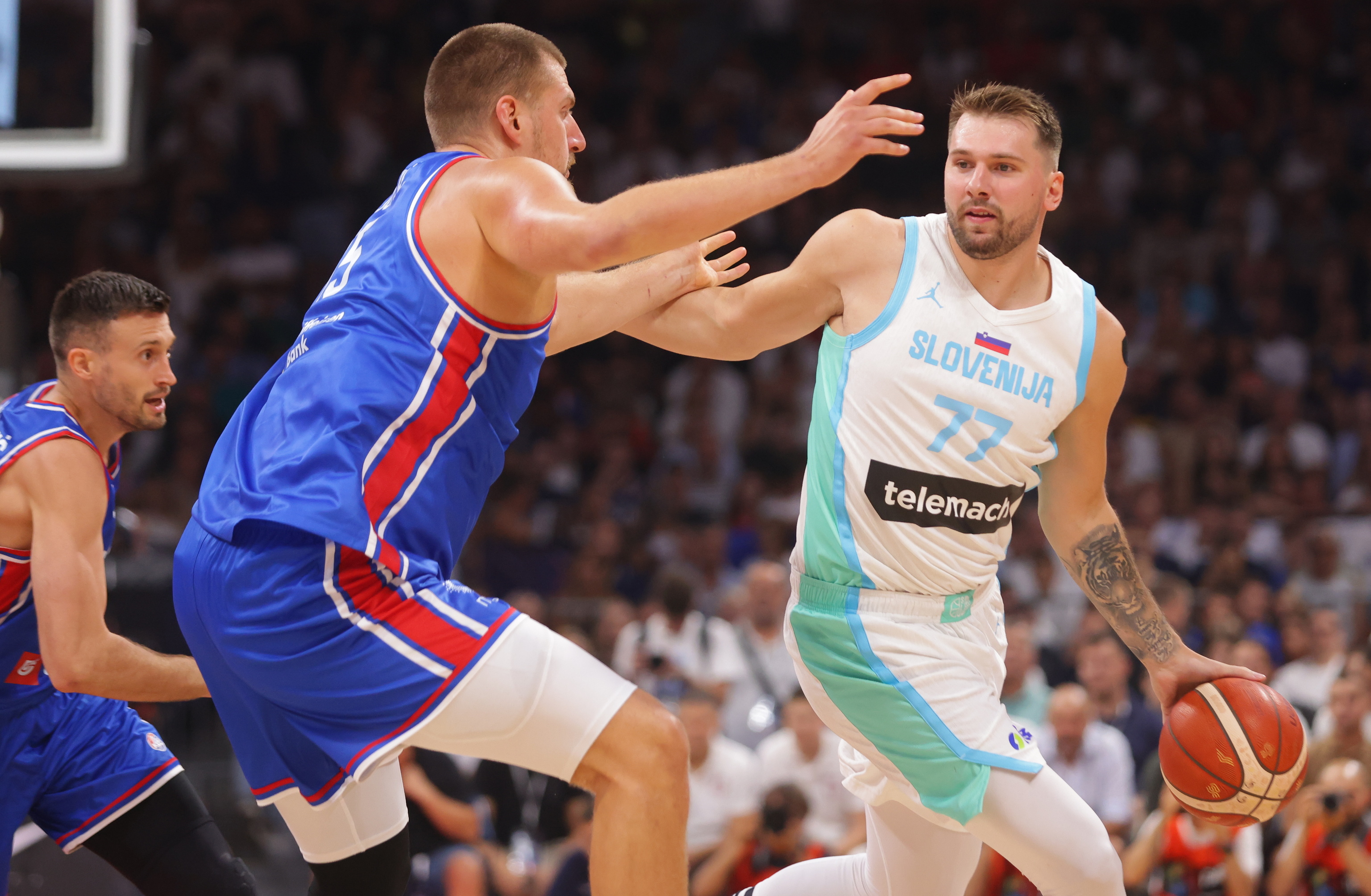 Doncic, defended by Jokic, in a recent friendly between Slovenia and Serbia.