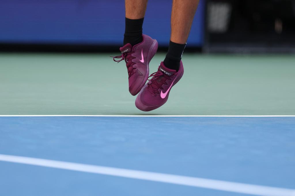 Alcaraz's feet during a serve.