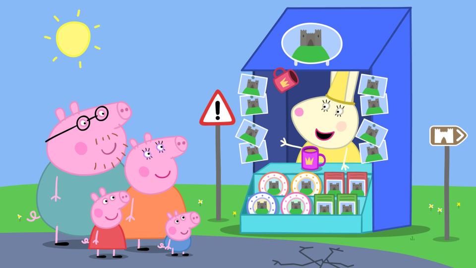 Ilustración de la familia Peppa Pig en un puesto de recuerdos.