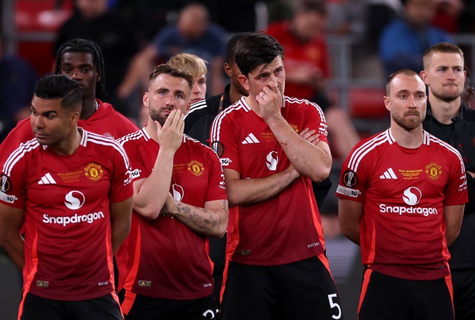 Asegurado jugadores del Manchester United después de un partido.