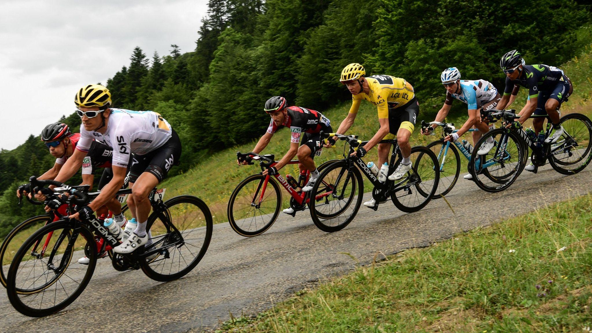 Geraint Thomas descends on a narrow road with Sky team-mates Richie Porte, Chris Froome and others during the 2017 Tour de France