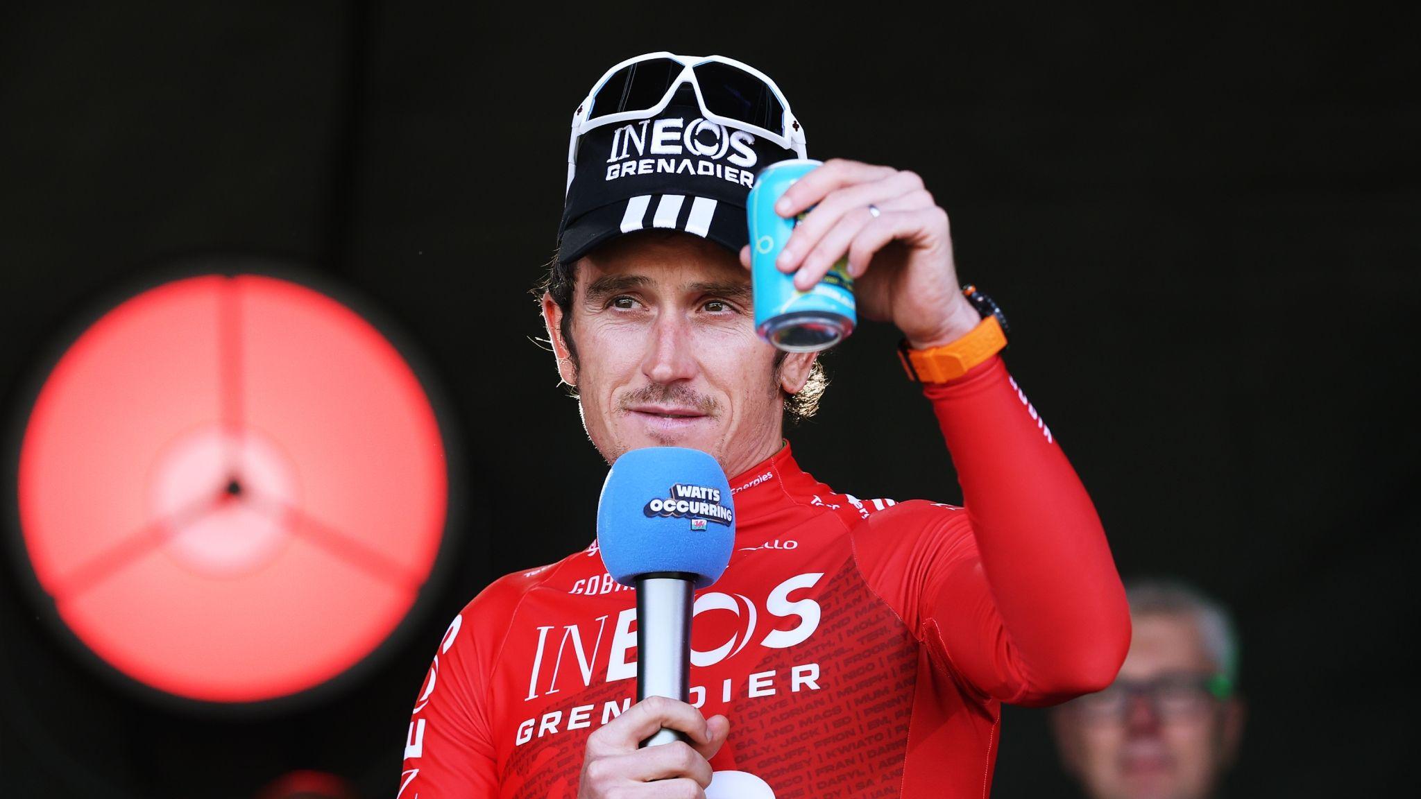 Geraint Thomas holds a microphone and raises a drink after his final professional race