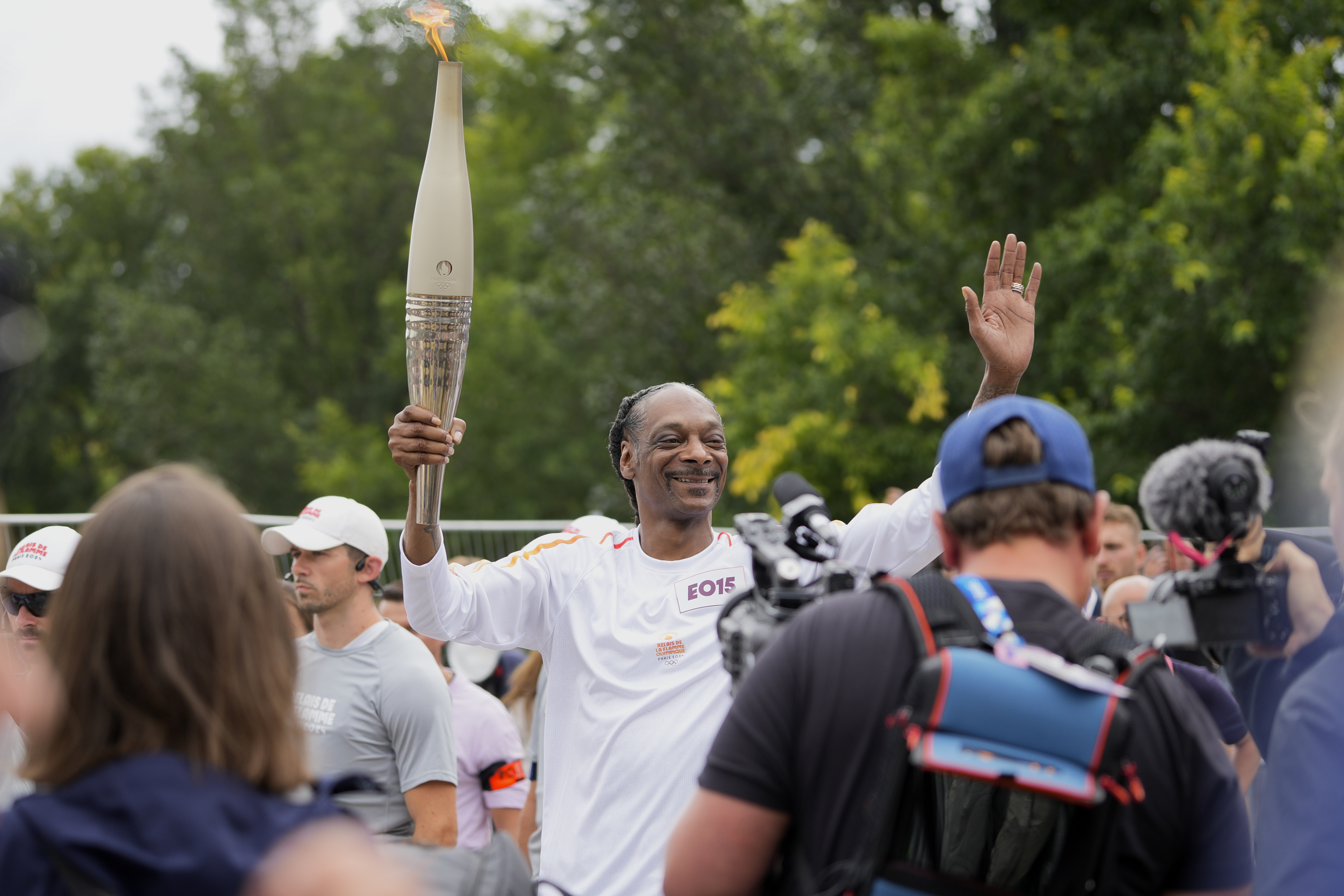 Il a couru avec la torche olympique