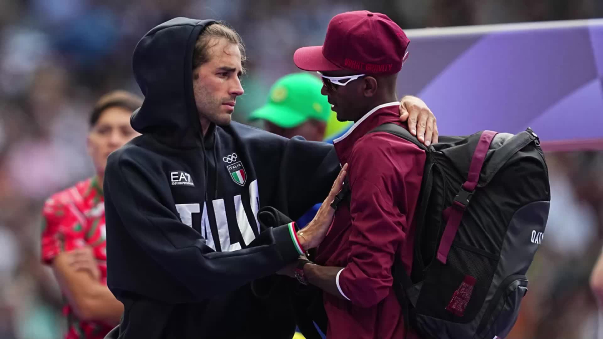 Il souffre, saute et réussit, quoique avec un frisson.  Mais le meilleur moment de la matinée olympique de Gimbo a été son geste envers son ami-rival.