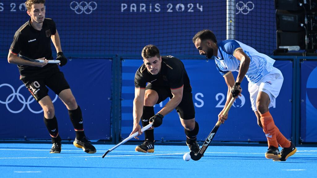 Les hockeyeurs allemands jouent pour l’OR