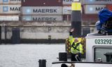 Un skipper sur un porte-conteneurs au terminal APM sur le Rotterdam Maasvlakte. Étant donné que les échanges avec les États-Unis ne représentent qu’une petite partie des échanges commerciaux avec les Pays-Bas, les conséquences des augmentations de droits de douane américaines seront limitées. 