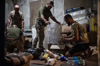 Soldiers put food, water and
