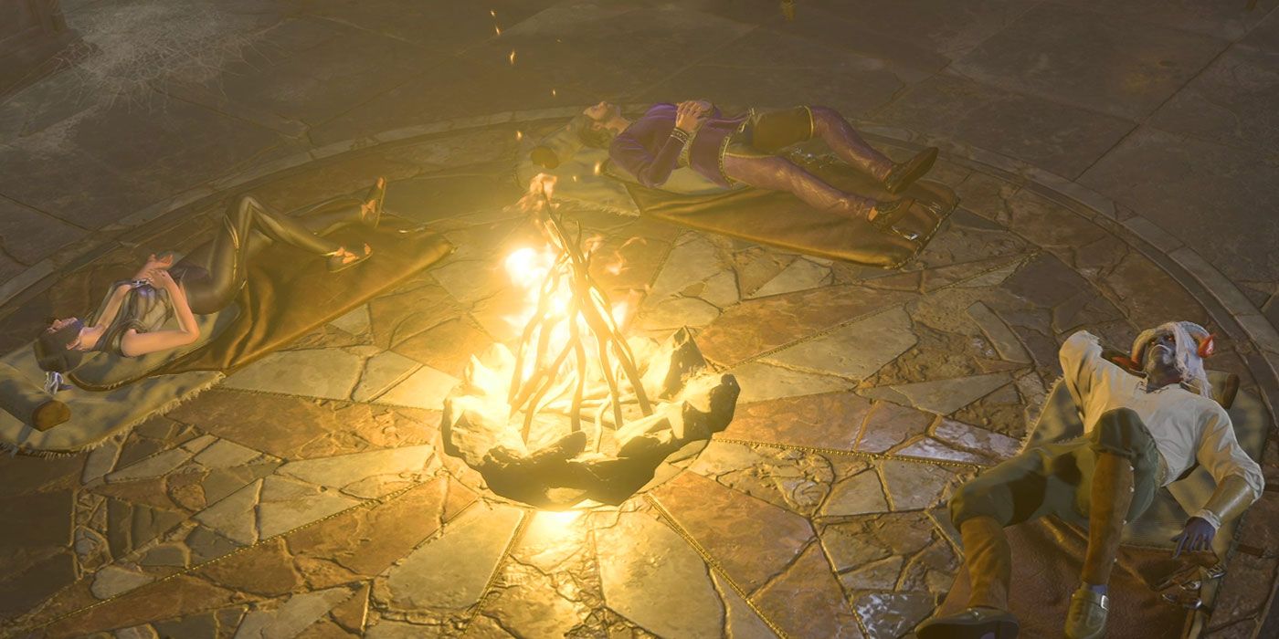 Baldur's Gate 3 partisi kamp ateşinin etrafında uyku tulumlarında uyuyor. 