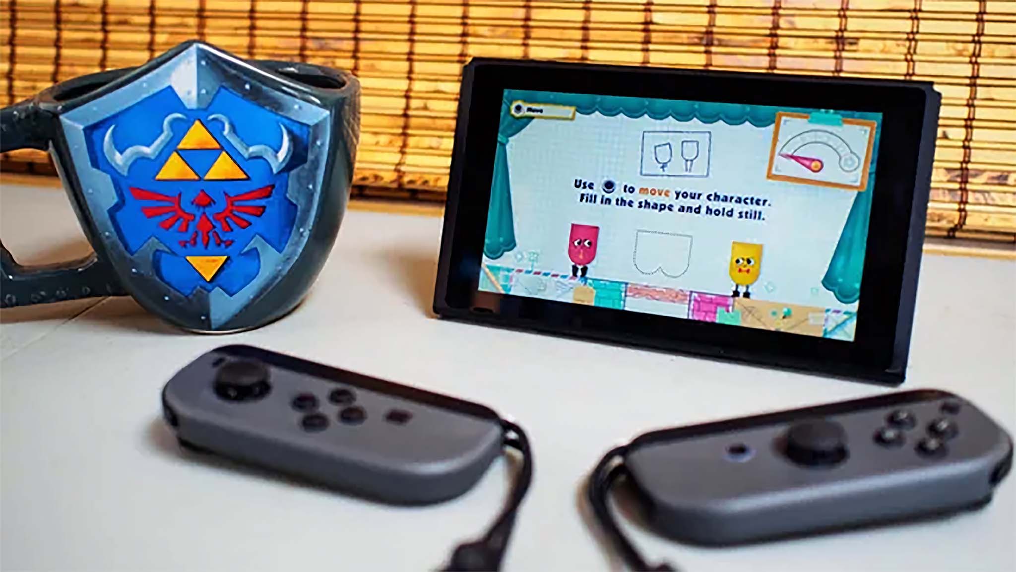 Kumandaları çıkarılmış ve ortak çok oyunculu bir oyun olan Snipperclips'i çalıştıran Nintendo Switch.
