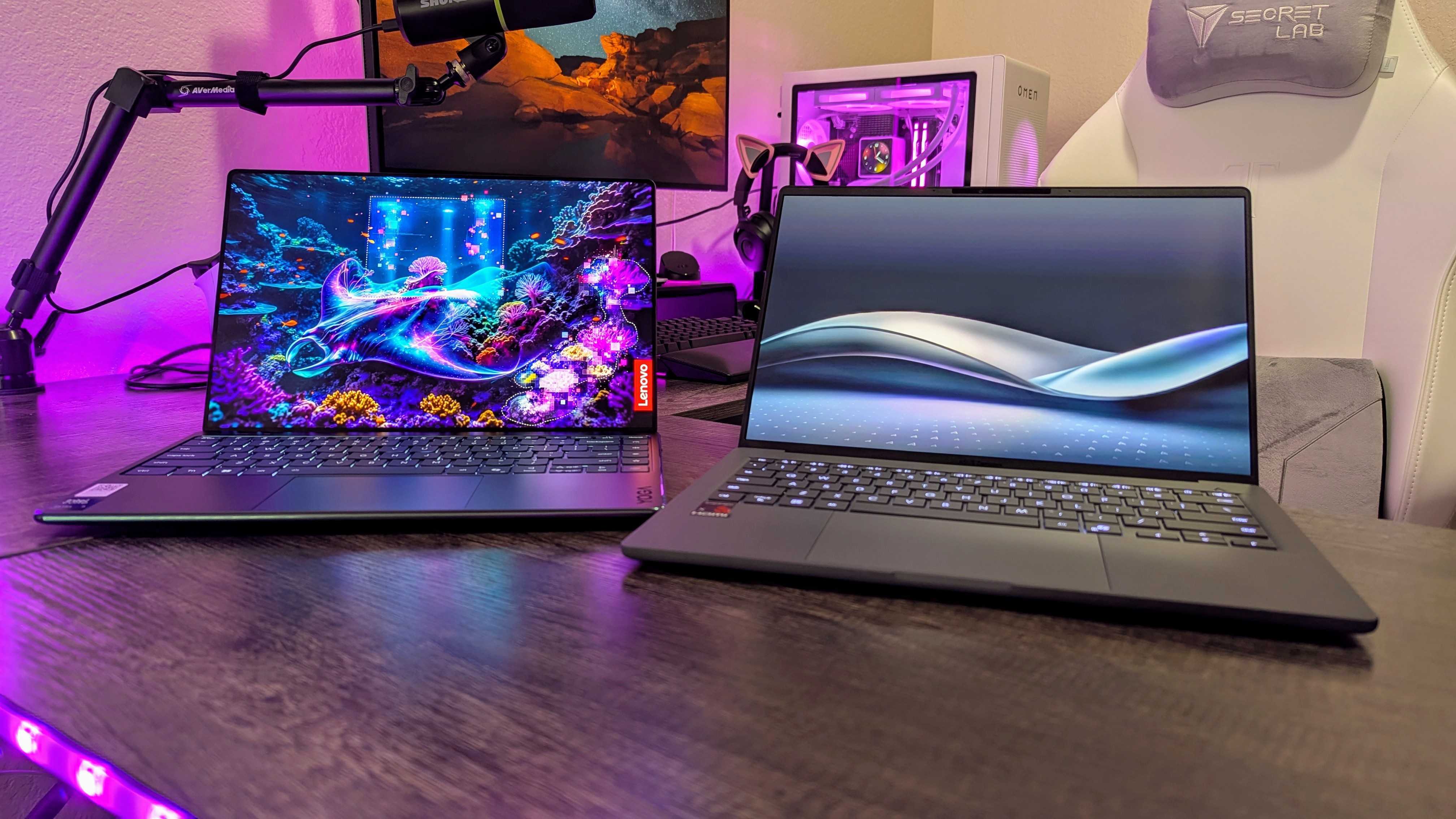 Lenovo Yoga Slim 9i 14 (Gen 10) ve Asus Zenbook A14 (2025) dizüstü bilgisayarların görüntüsü.