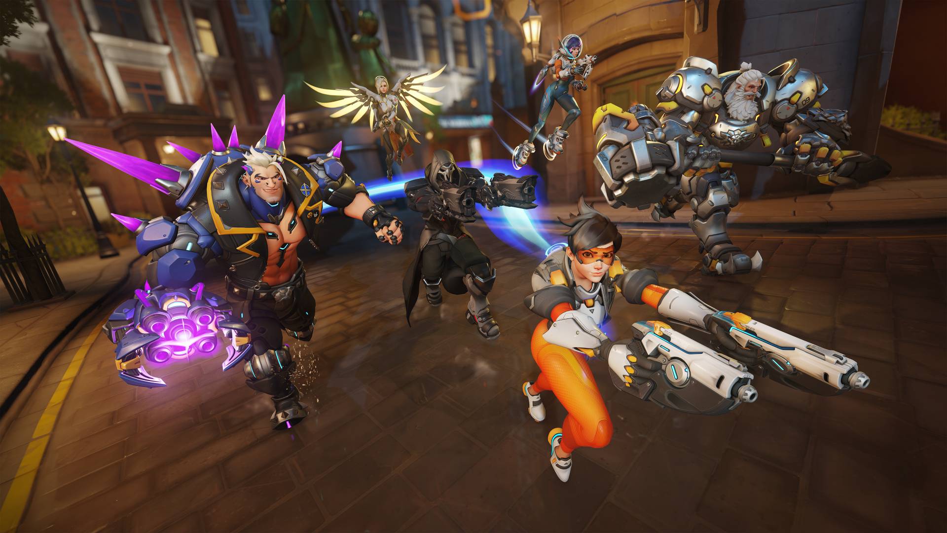 Overwatch-2-Season-15-interview-aaron-Keller-Pcgamesn Tracer, Reaper, Merhamet, Hazard, Juno ve Reinhardt savaşa hazırlanan bir sokakta koşuyor