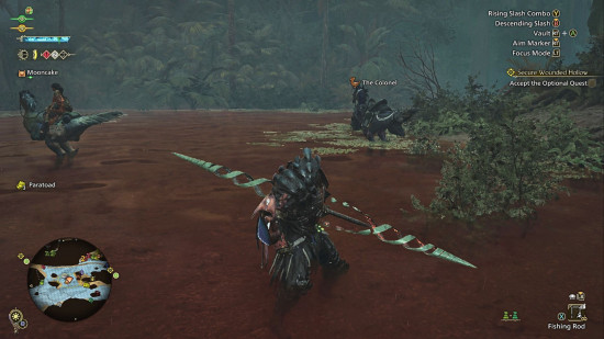 Monster Hunter Wilds Böcek Glaive: Bir adam, büyük bir mızrak benzeri silahla poz veren kırmızı bir nehirde buzağı derinliğinde duruyor.