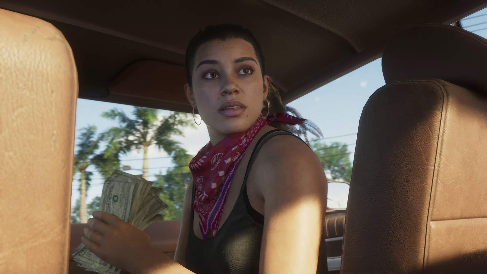 Grand Theft Auto 6 ekran görüntüsü, bir arabada kahramanı Lucia'yı gösteriyor