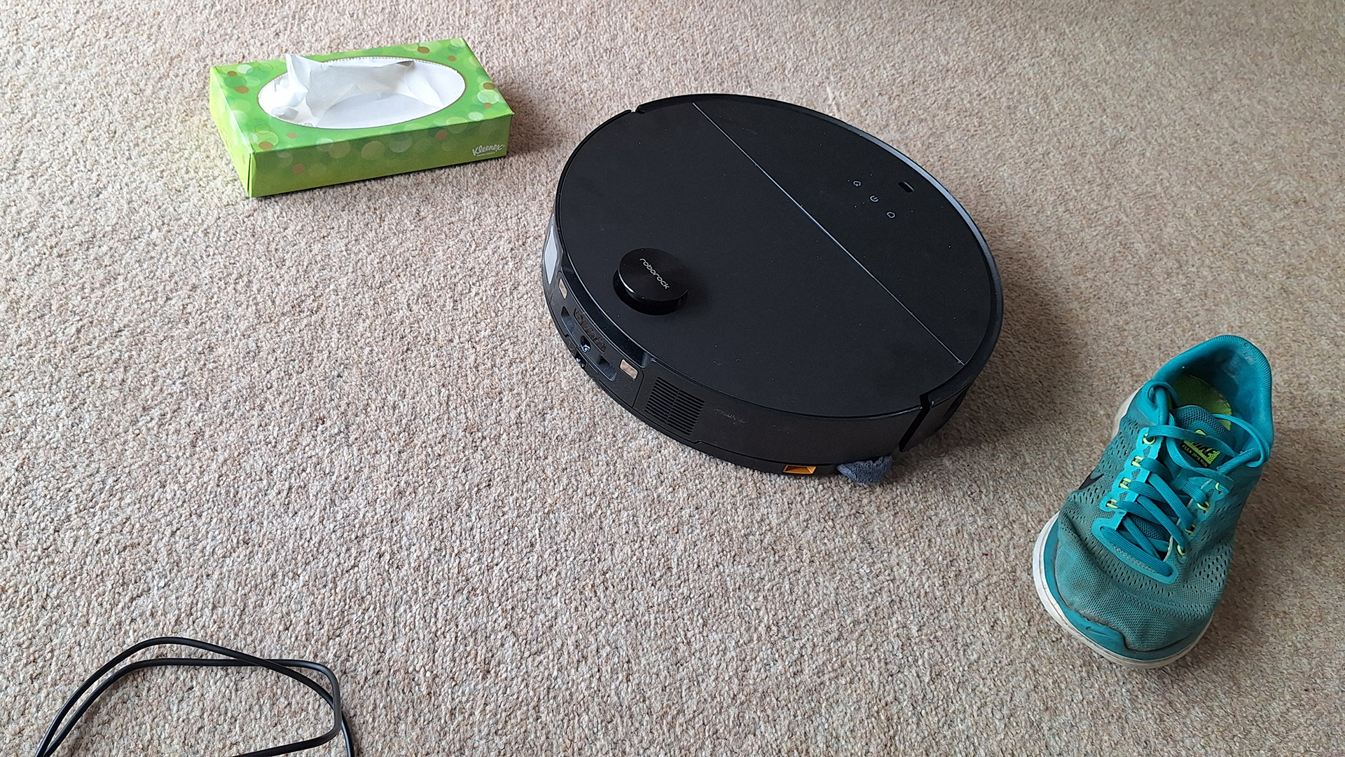 Roborock Saros 10 robot vacuum avoiding a shoe