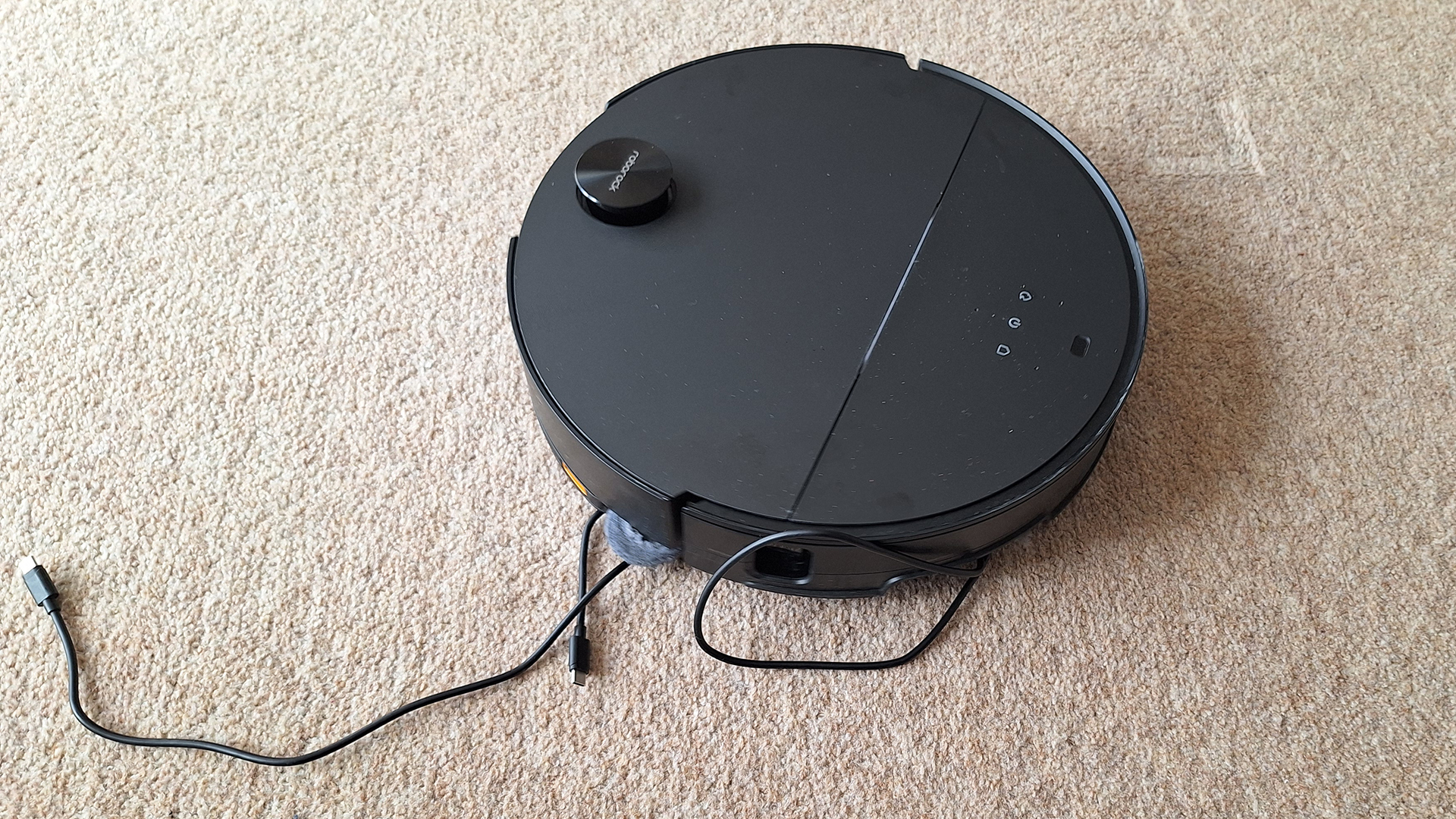 Roborock Saros 10 robot vacuum eating a cable
