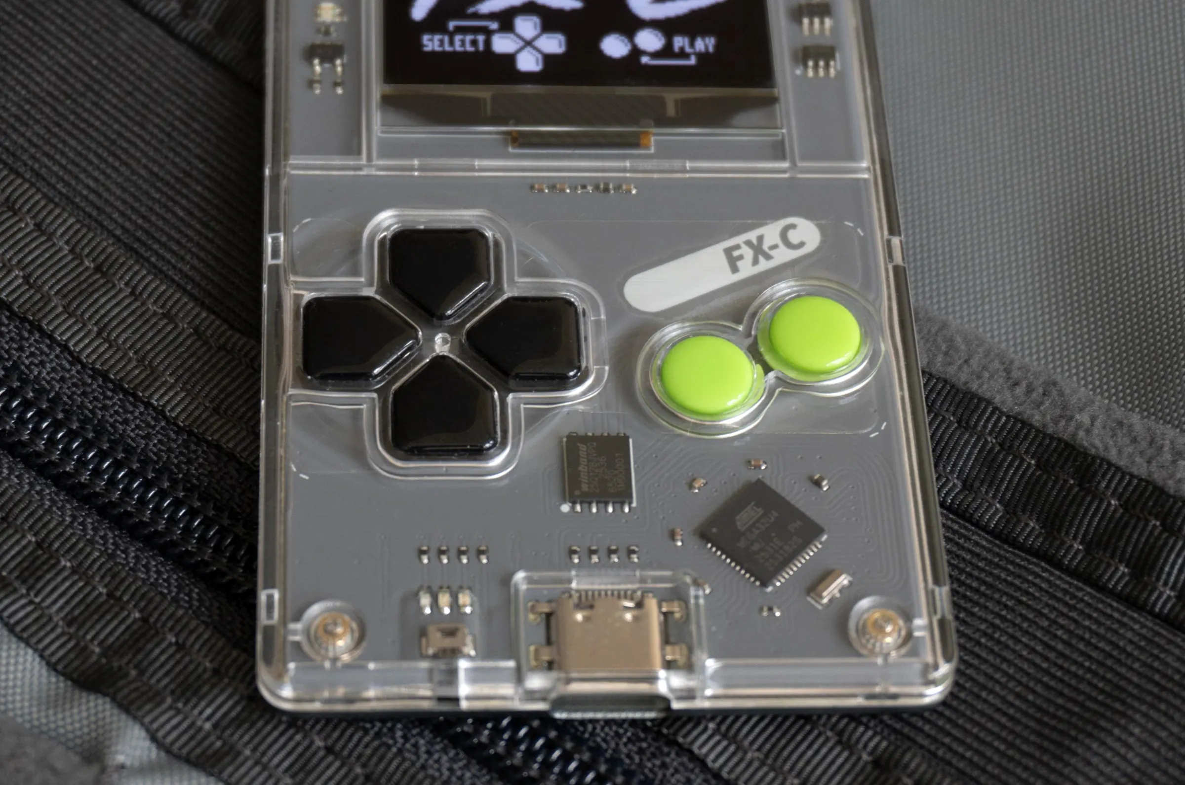 A close-up of the Arduboy FX-C’s buttons.